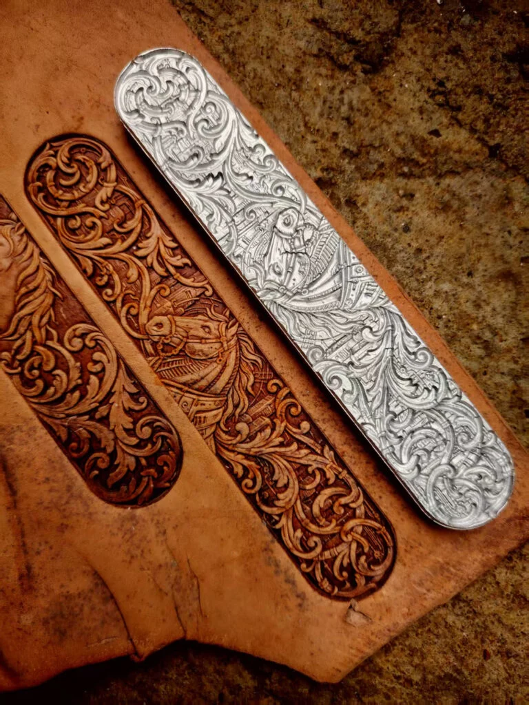 Floral leather stamp mold beside two embossed leather impressions
