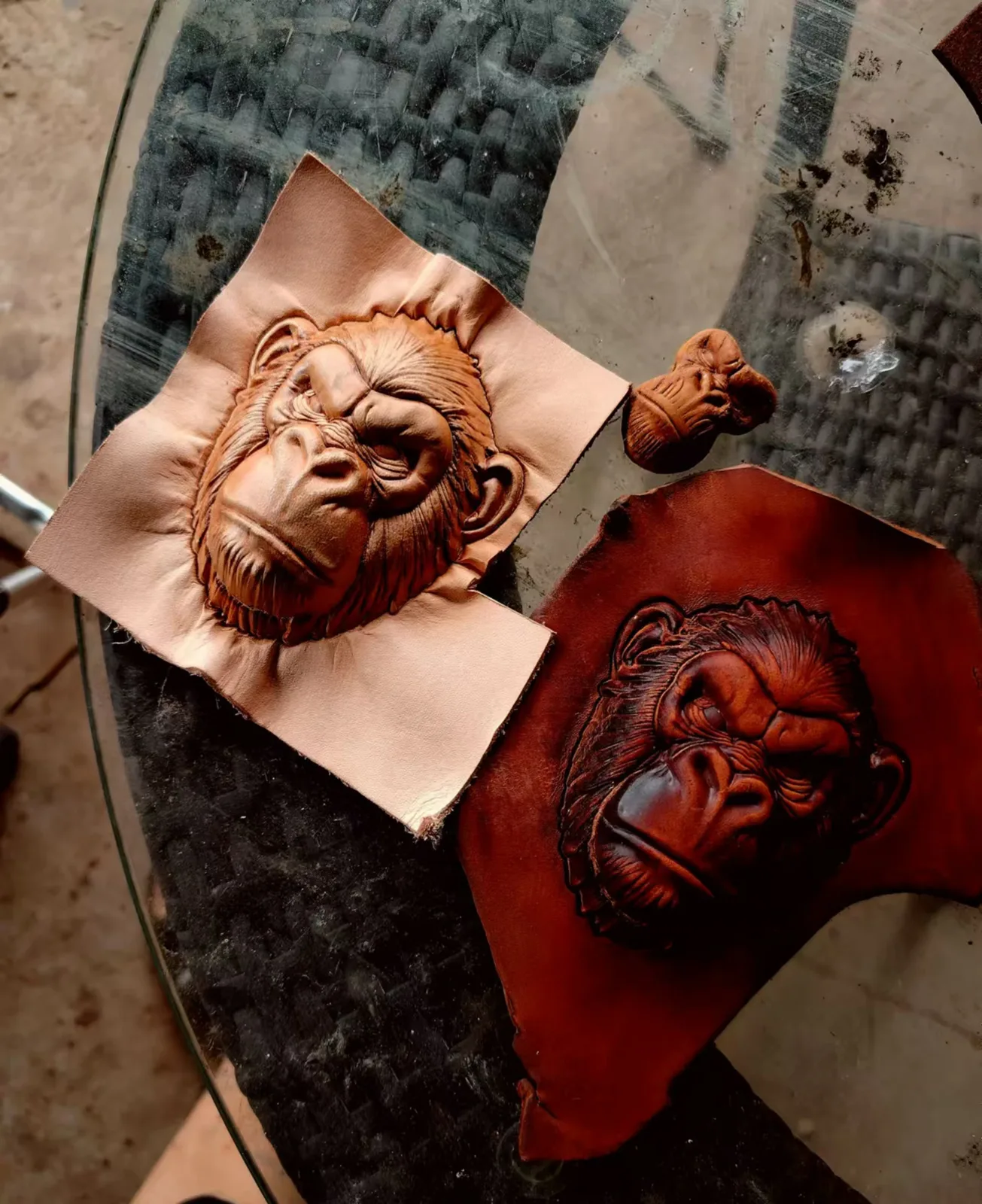 Gorilla face impressions stamped into natural and dyed leather