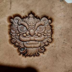 Lion head leather stamp mold embossed on leather sample