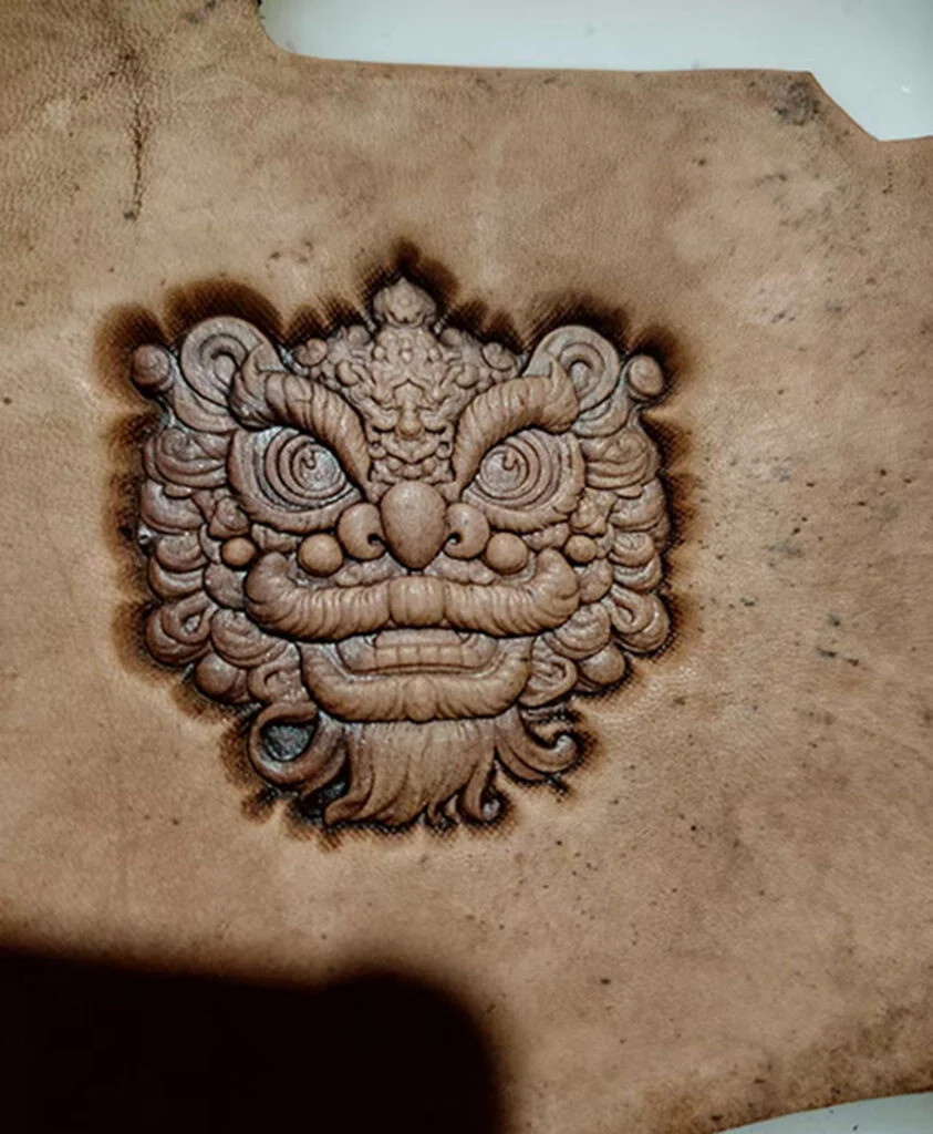 Lion head leather stamp mold embossed on leather sample