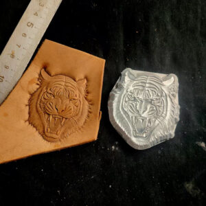 Roaring tiger leather stamp mold with embossed vegetable-tanned leather sample and ruler