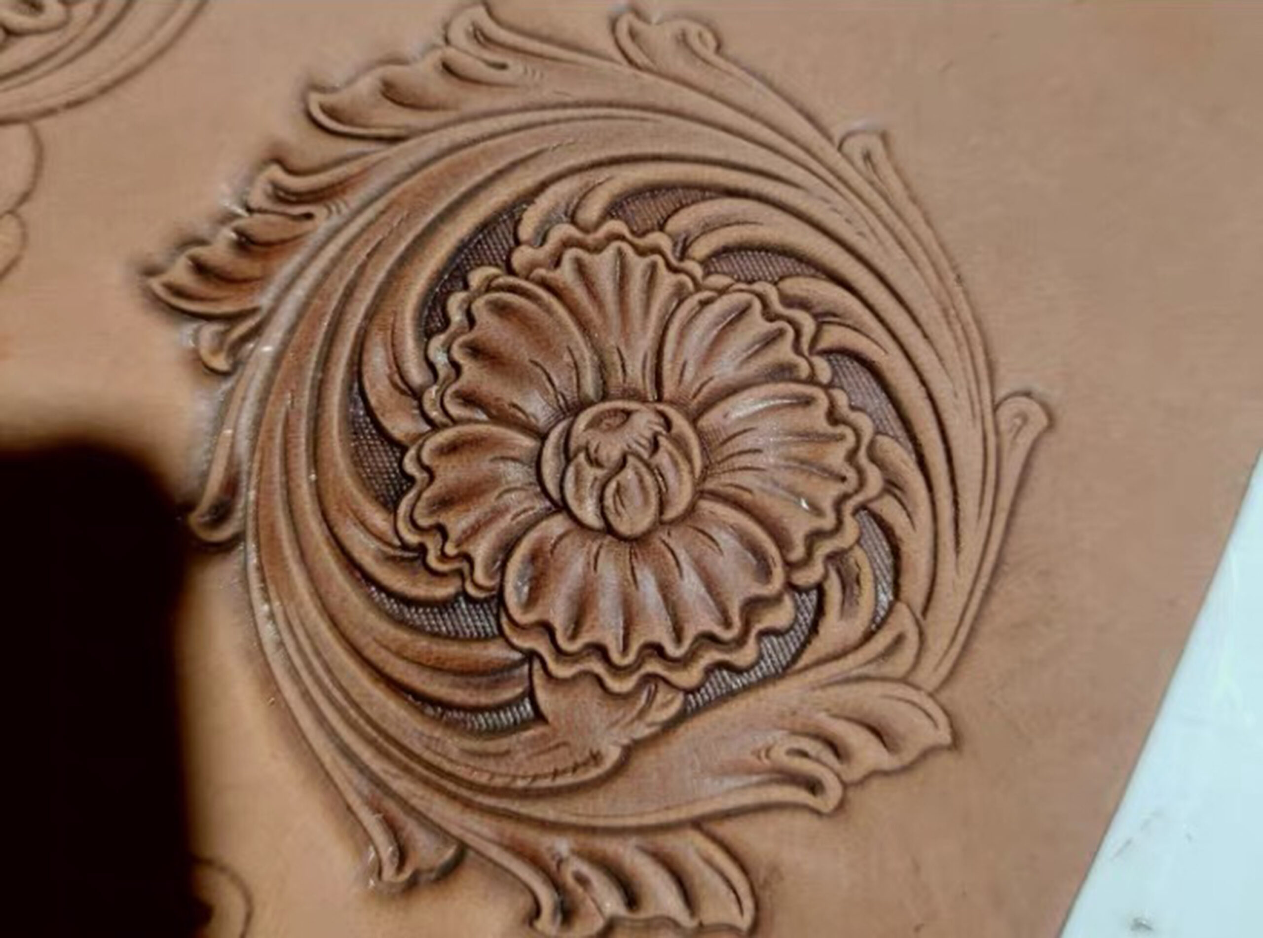 Corner floral leather stamp mold with embossed vegetable-tanned leather sample