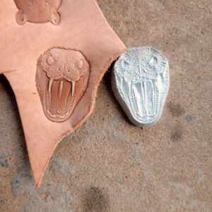 Snake leather stamp mold in 2A12 duralumin with embossed leather sample
