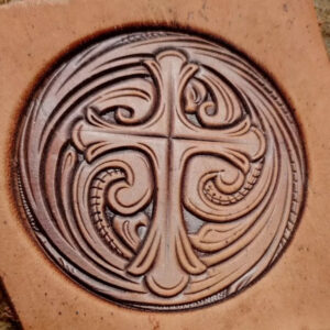 Arabesque round leather stamp mold with embossed vegetable-tanned leather sample