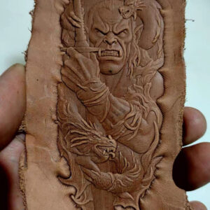 Orc and dragon leather stamp mold with embossed vegetable-tanned leather sample