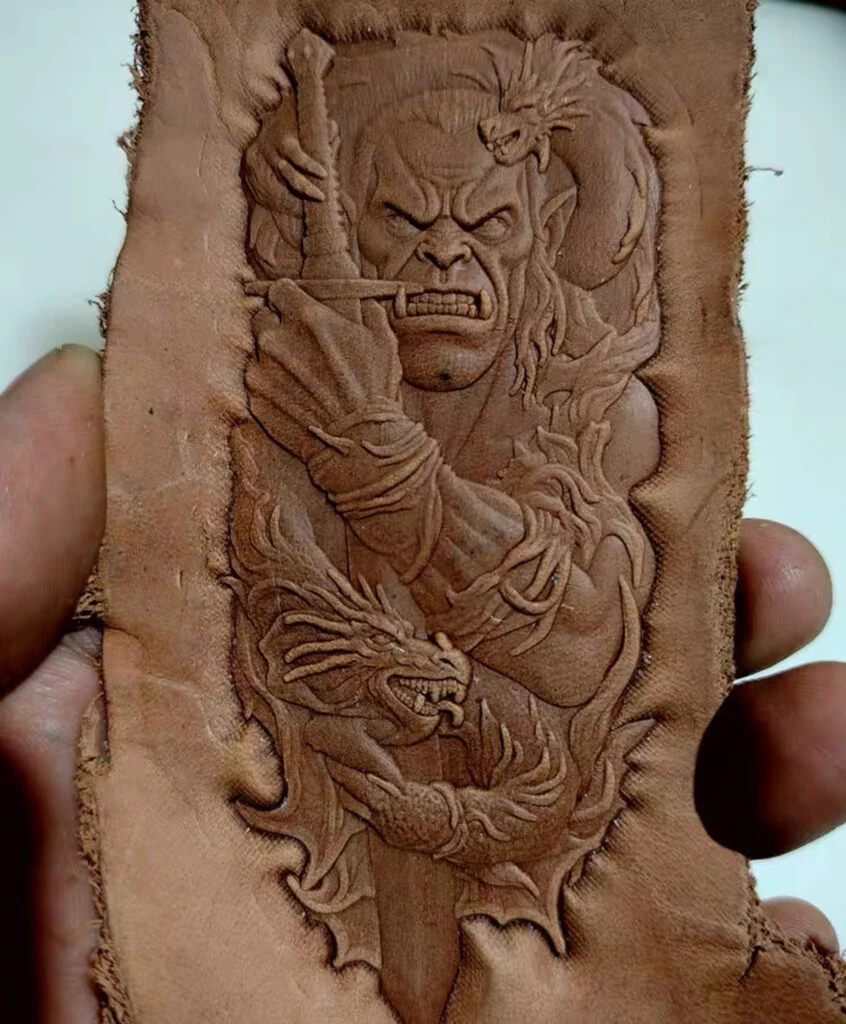 Orc and dragon leather stamp mold with embossed vegetable-tanned leather sample