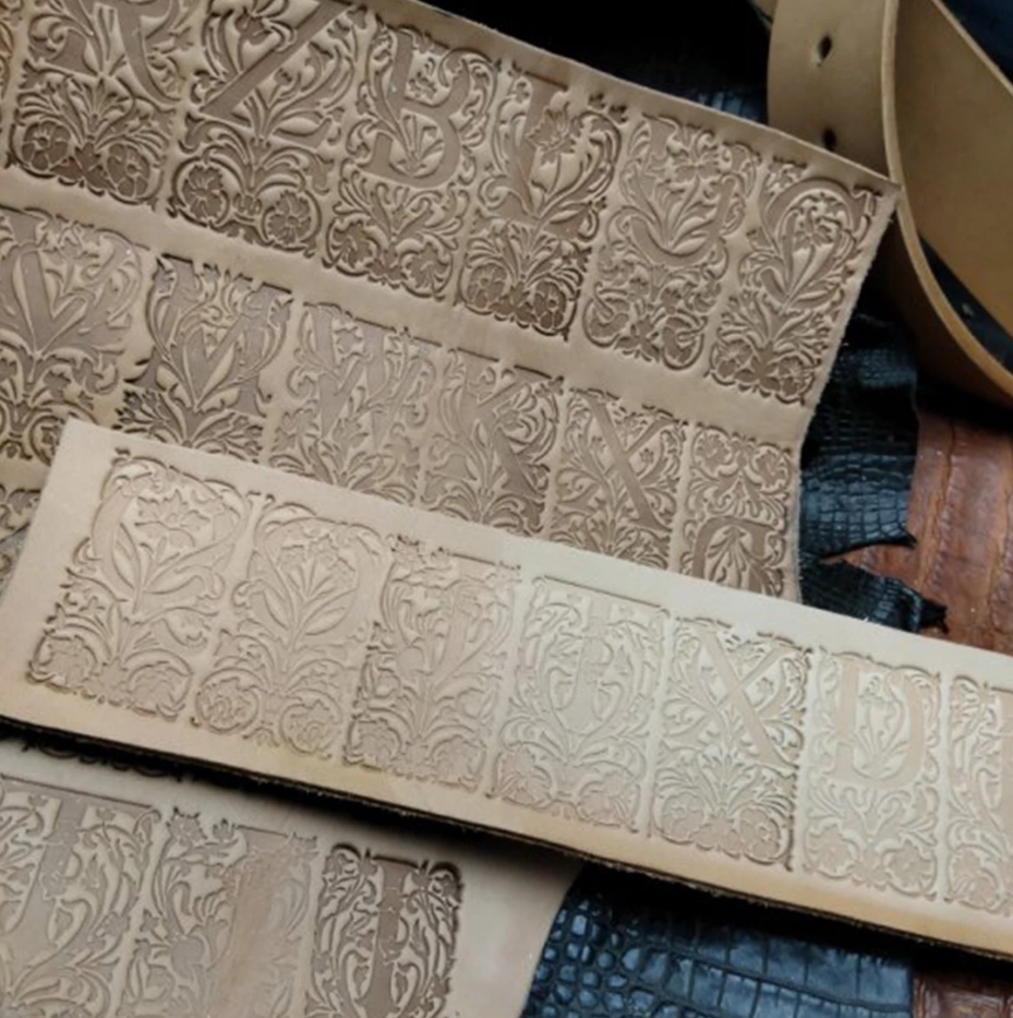 floral alphabet leather stamp impression on vegetable tanned leather