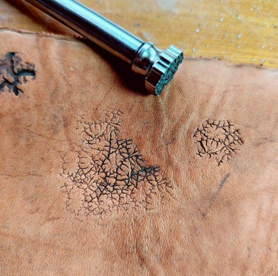 close up of crater texture leather stamp detail