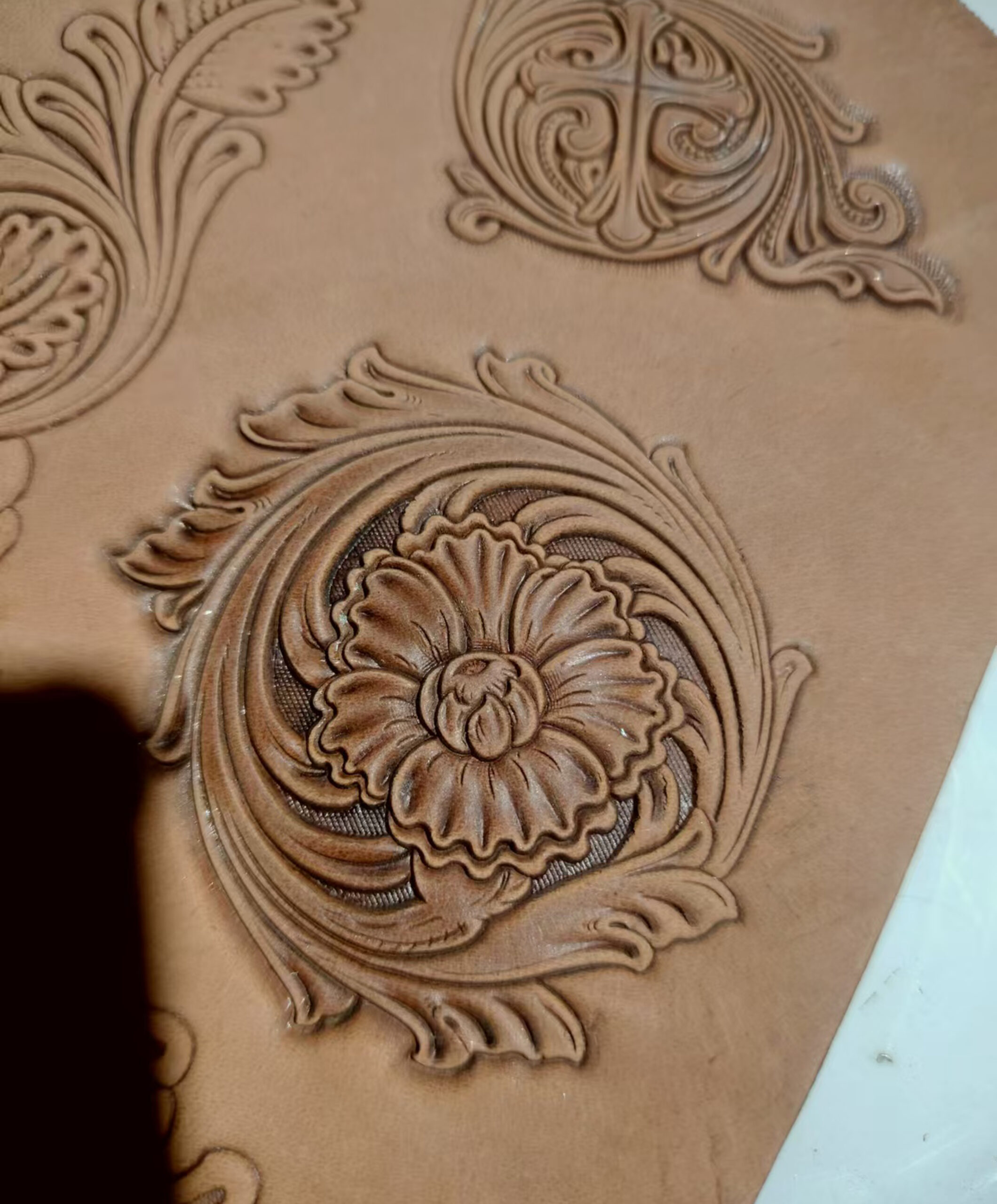 Corner floral leather stamp mold with embossed vegetable-tanned leather sample