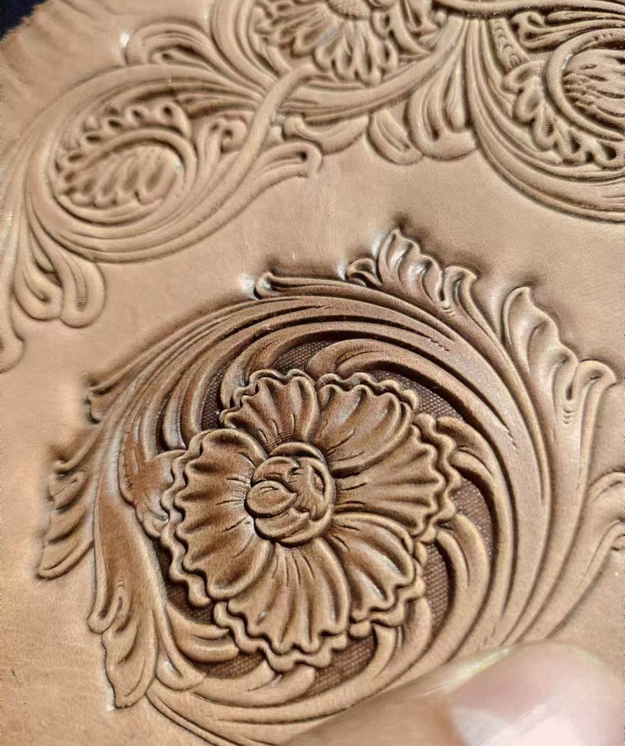 Corner floral leather stamp mold with embossed vegetable-tanned leather sample