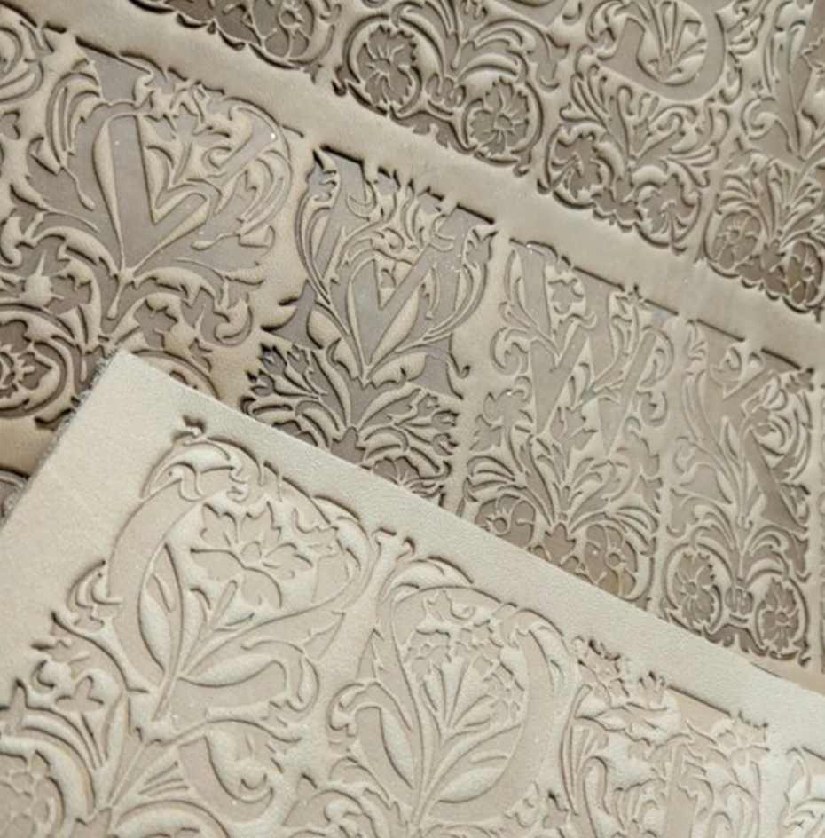 floral alphabet leather stamp impression on vegetable tanned leather