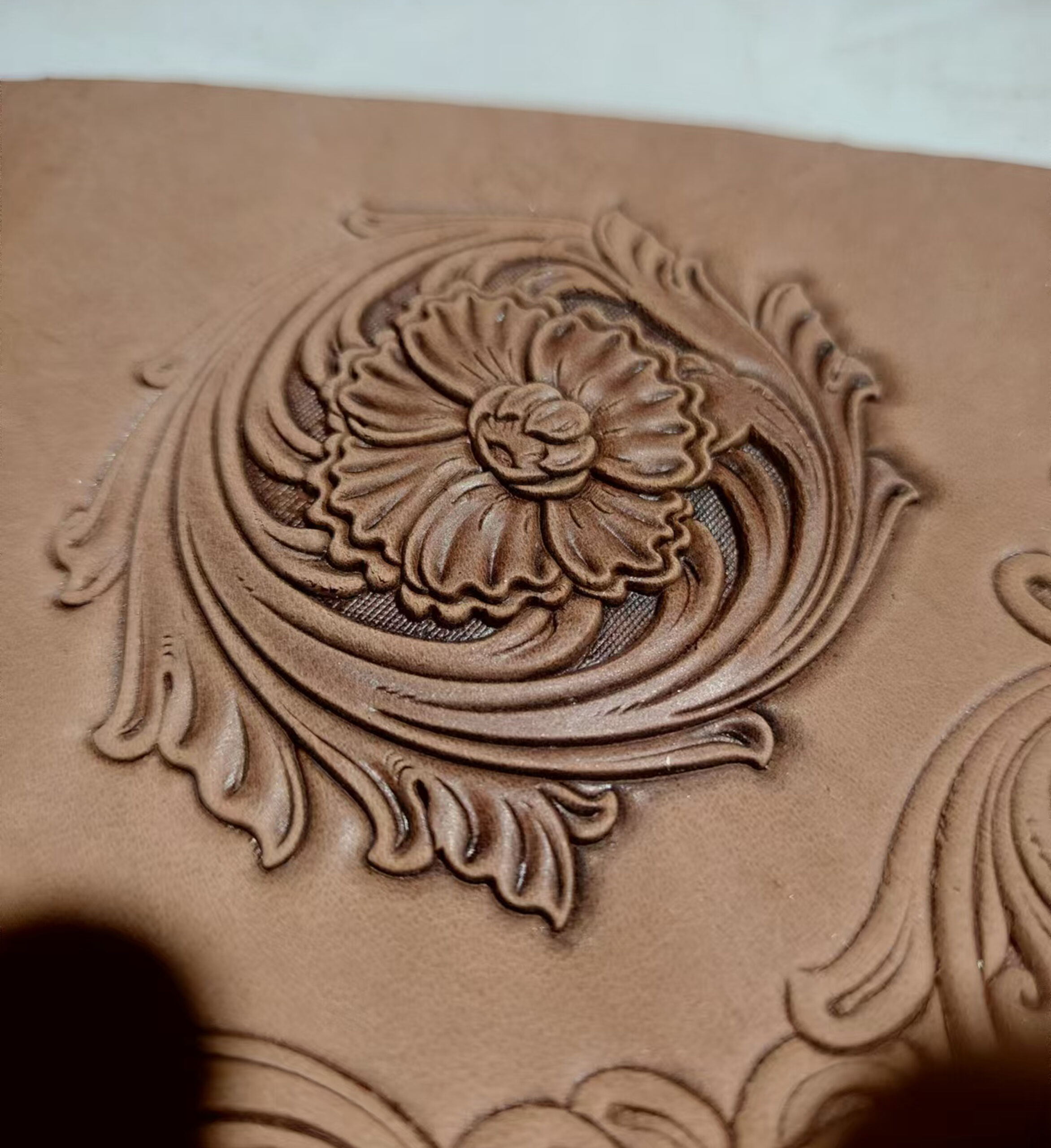 Corner floral leather stamp mold with embossed vegetable-tanned leather sample