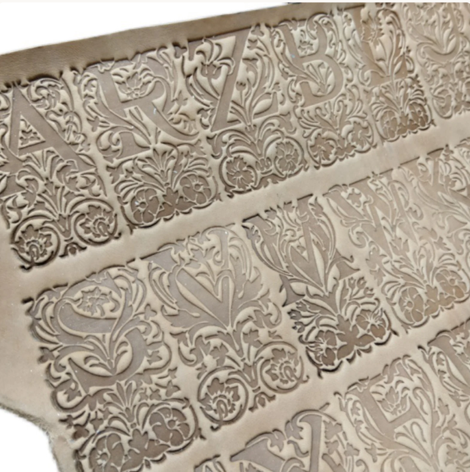 floral alphabet leather stamp impression on vegetable tanned leather