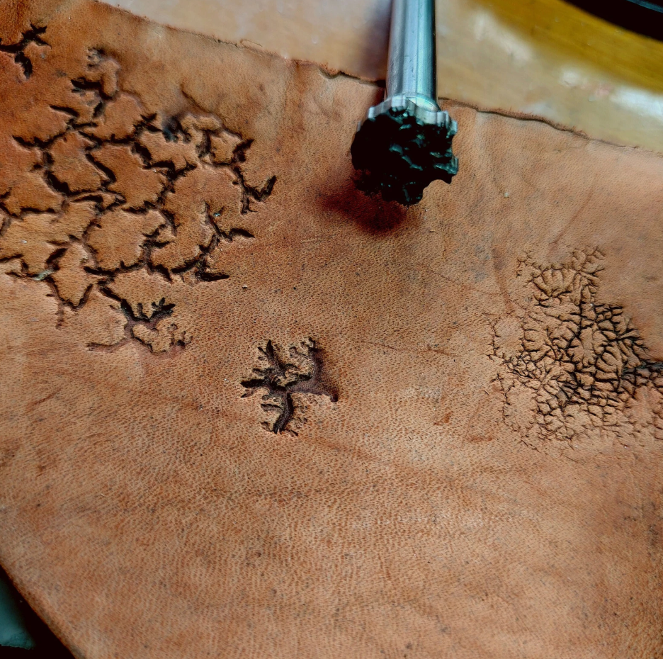 close up of crater texture leather stamp detail