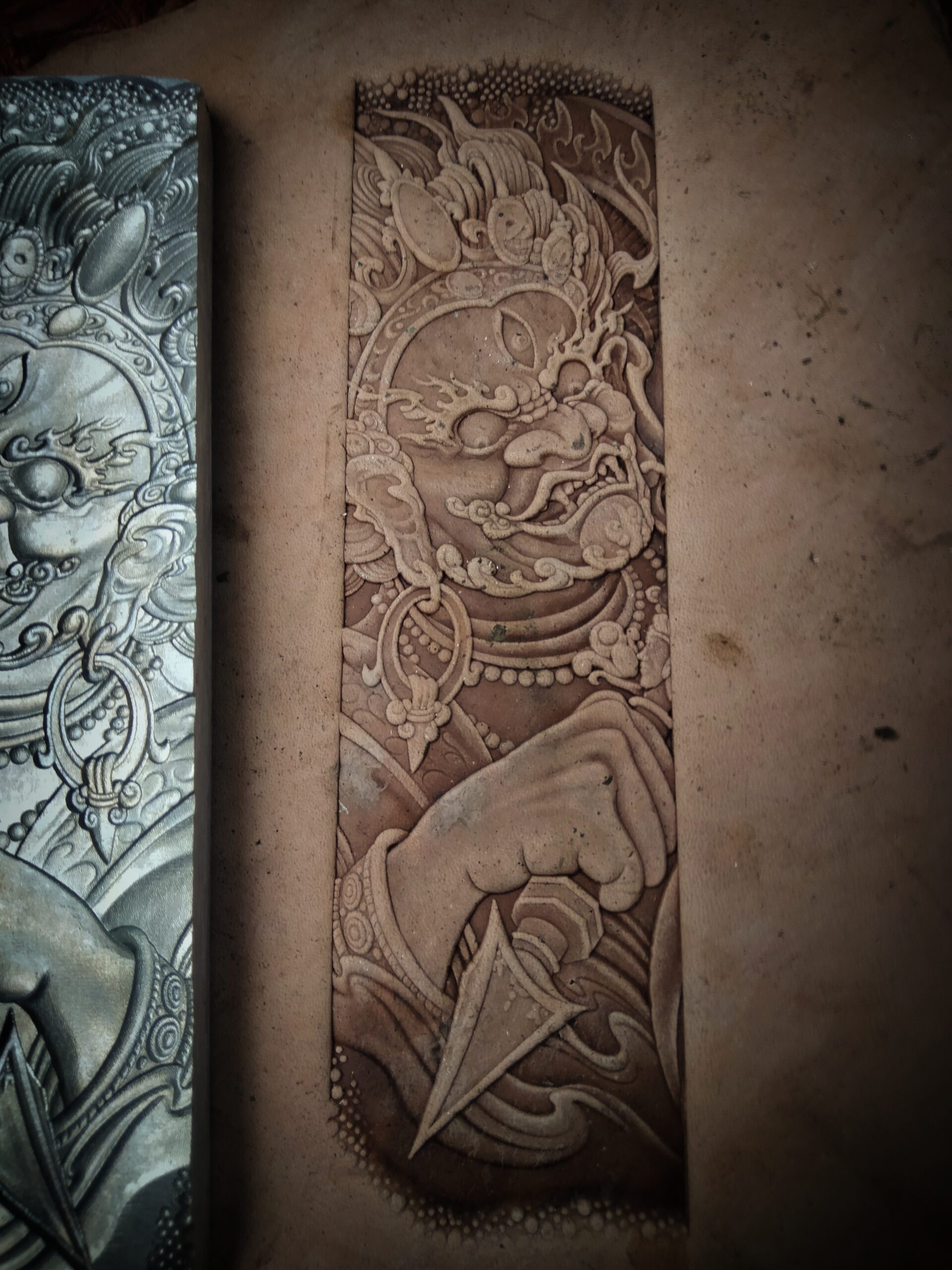close up of vintage zhongkui leather stamp mold detail