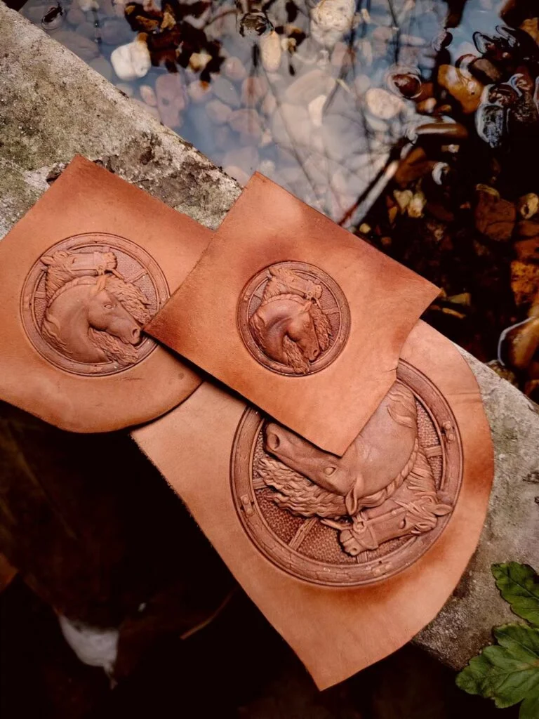 Three sizes of round horse head impressions on vegetable-tanned leather