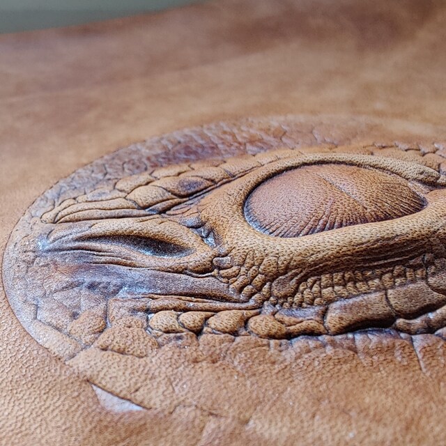 Customer dragon eye leather embossing with layered texture
